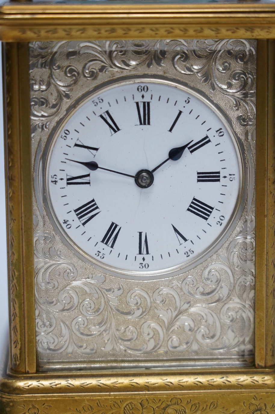 An engraved brass carriage clock by Richard & Cie, serial number 648, with key, 14cm. Condition - fair, dial cracked. Not tested as working